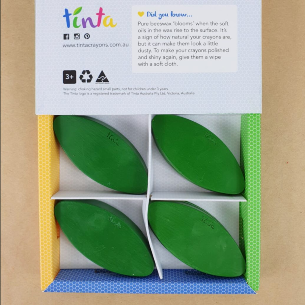 A box of green petals is half-open with the lid on backwards to showcase the design, especially the recyclable symbol.